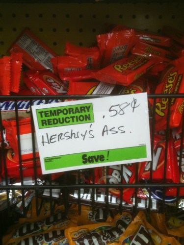 Assorted Hershey's candy at the grocery store that is labeled "Hershey's Ass."